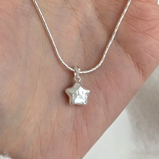 Star Pendant on Silver Necklace